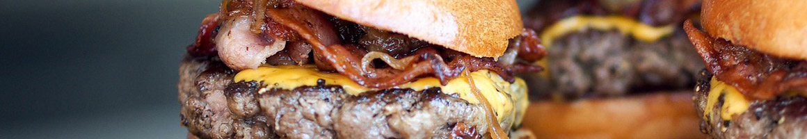 Eating American (Traditional) Burger at Mazos Hamburgers restaurant in Milwaukee, WI.